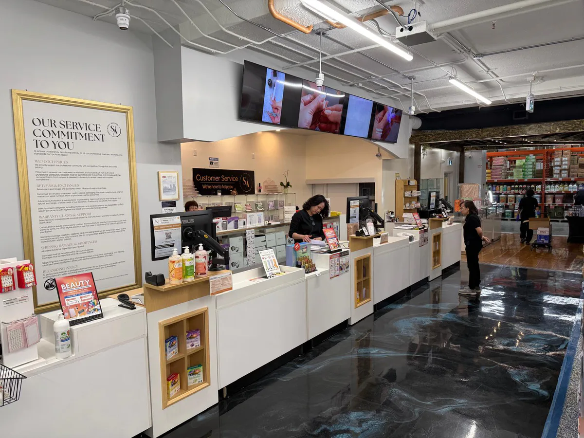 Supply & Apply customer-service counter beside the finished retail floor.